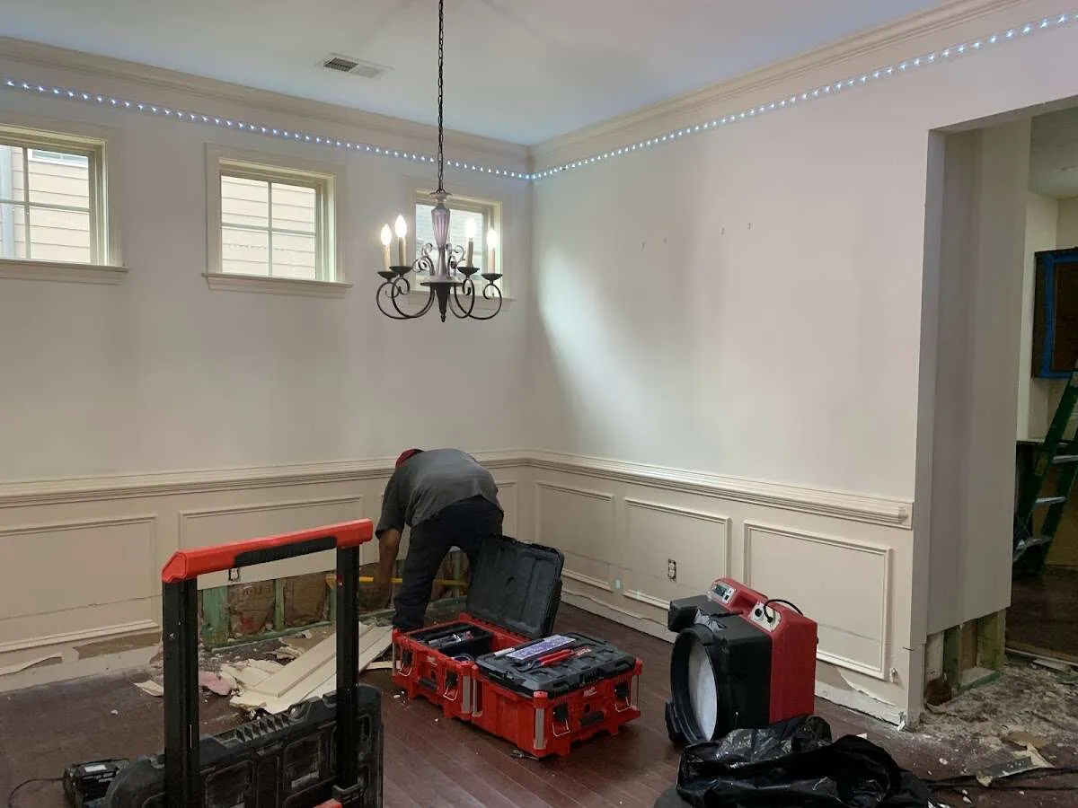 Restoration technician with professional equipment in Howard